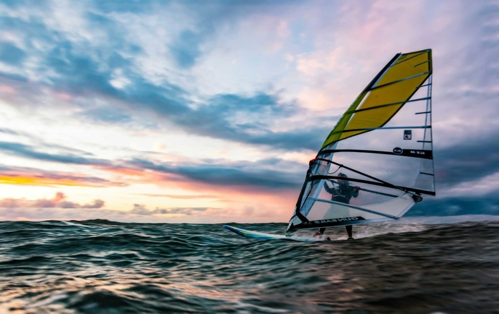 windsurfing at sunset in ireland