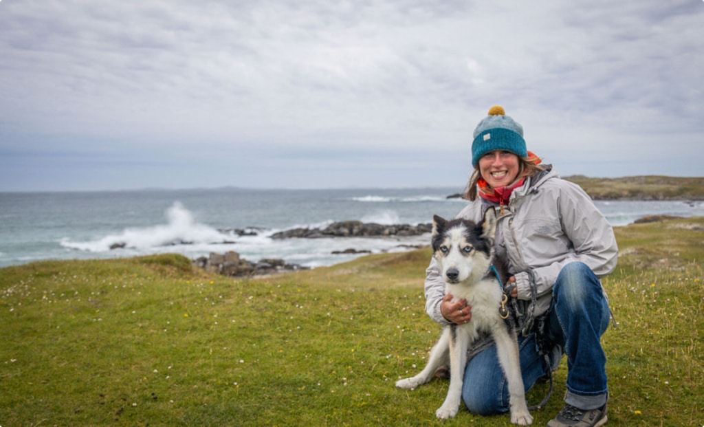 woman and husky near beach - move with nature