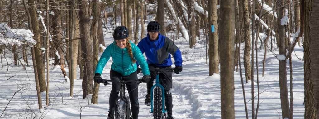 couple in the snow with fat bikes